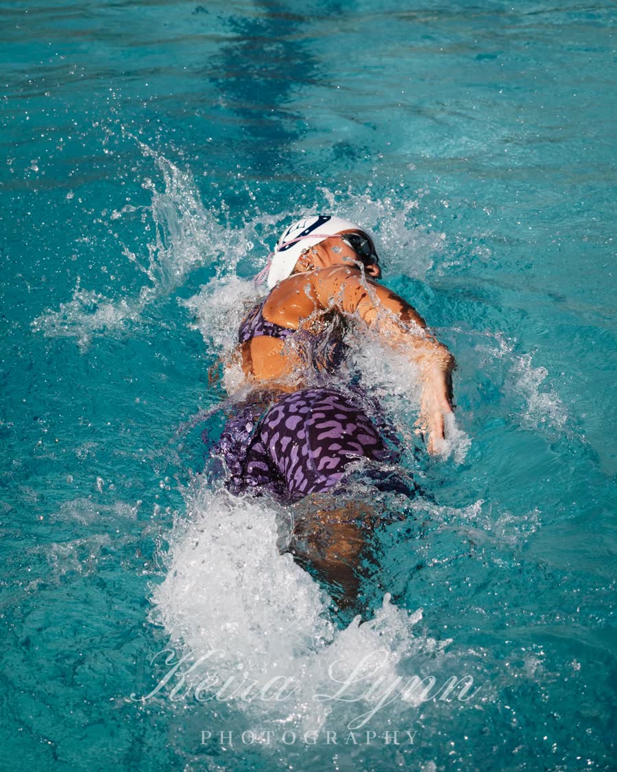 Emmy racing backstroke at League Finals.